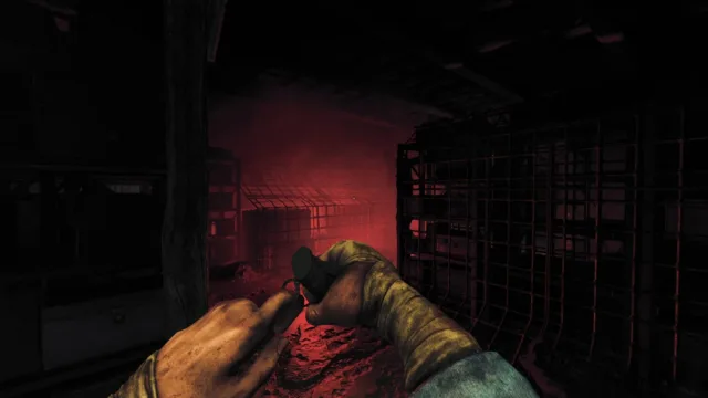 Amnesia: The Bunker — a wounded arm in a red-lit room