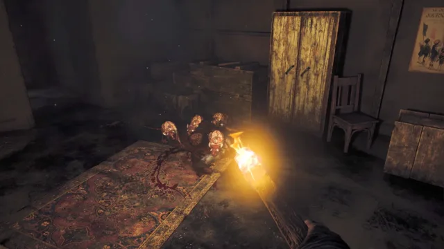 Amnesia: The Bunker — a light illuminating debris and a wooden door