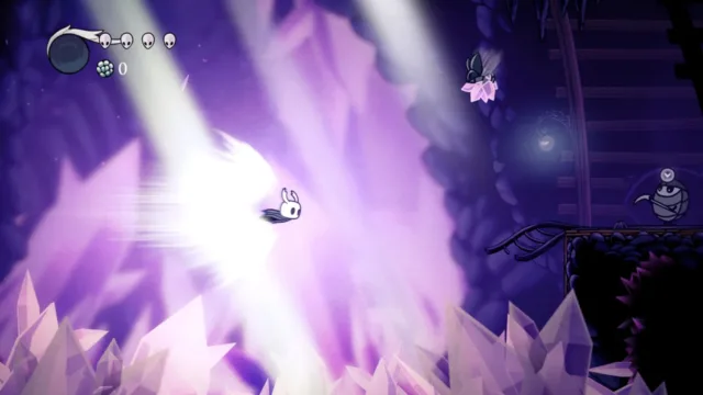 Hollow Knight — a bright attack among purple crystals