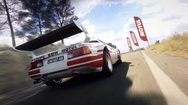 DiRT Rally 2.0 — the rear of a rally car beside roadside flags