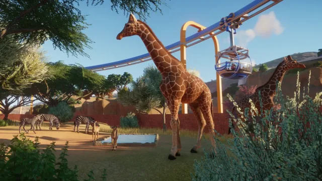 Planet Zoo — giraffes beside guest-viewing structures