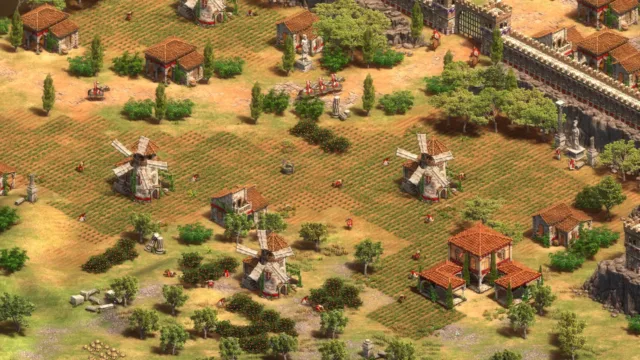 Age of Empires II: Definitive Edition — PC screenshot: A settlement with towers and units