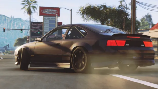 BeamNG.drive — PC screenshot: A hatchback sliding on a road