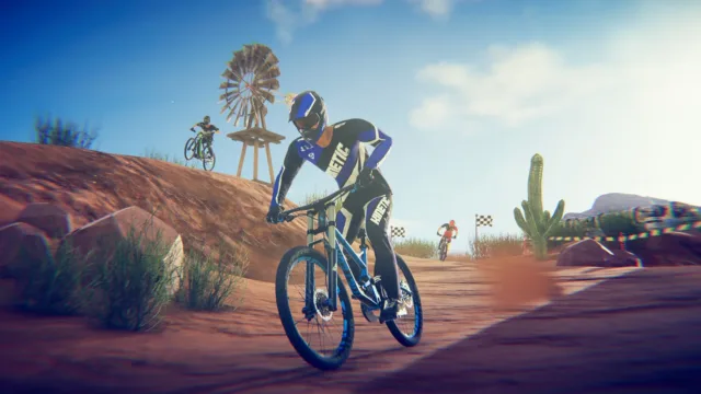 Descenders — PC screenshot: A cyclist riding through desert terrain