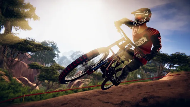 Descenders — PC screenshot: A cyclist descending a woodland trail