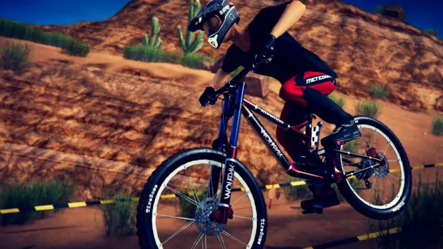 Descenders — PC screenshot: A cyclist leaning into a dirt turn