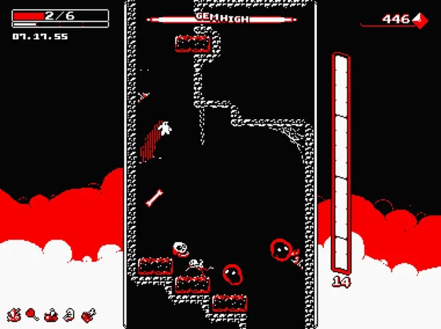 Downwell — PC screenshot: Descending through a narrow cavern with red hazards