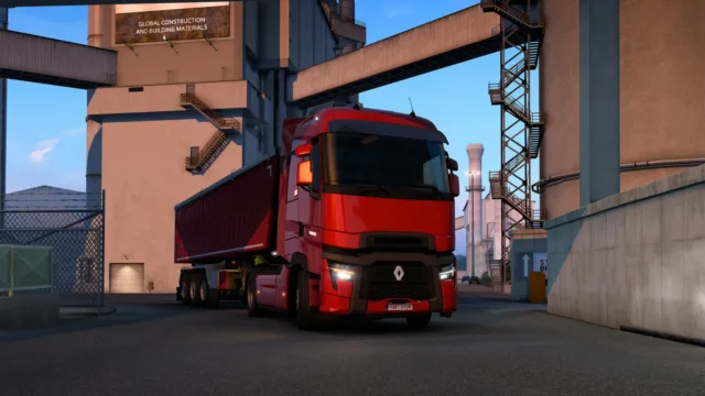 Euro Truck Simulator 2 — PC screenshot: A red truck beside a loading area