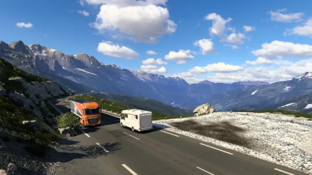 Euro Truck Simulator 2 — PC screenshot: A truck driving through mountain scenery