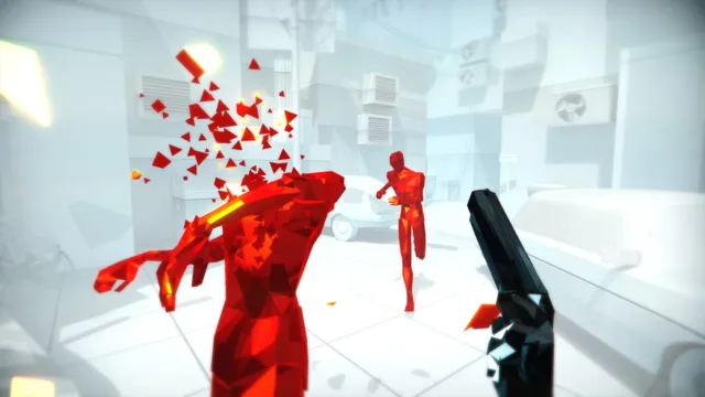 SUPERHOT — PC screenshot: A pistol aimed at shattered red enemies