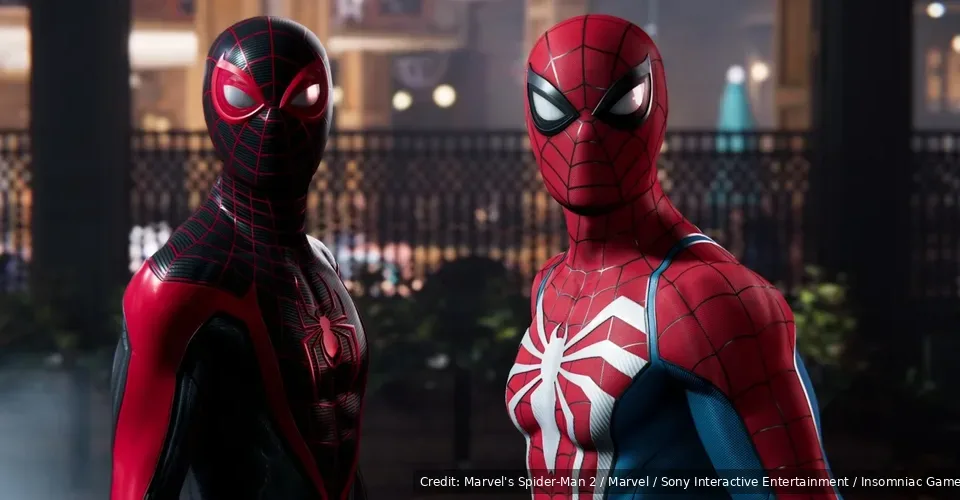 Peter Parker and Miles Morales standing together in their red-and-blue and black-and-red Spider-Man suits in Marvel's Spider-Man 2.
